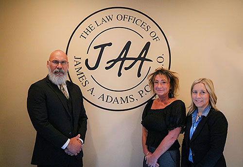 James A. Adams with his team